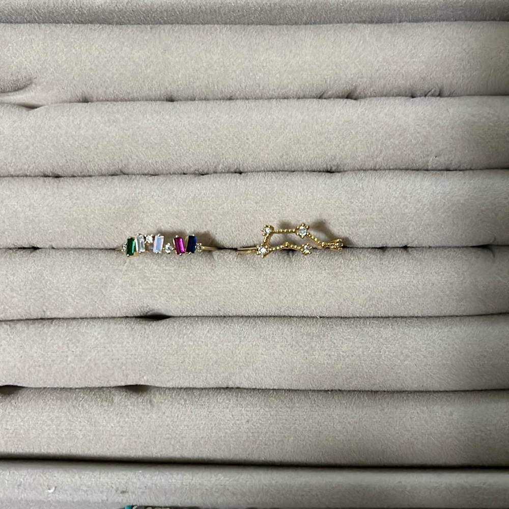 Two rings: (1) Gemini gold ring; (2) Fun multicolored, silver ring, sizes 5.5
